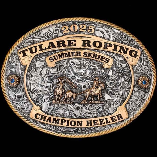 "Our Tulare Classic Buckle is a classic cowboy Buckle fit to show off your roping victory! This Buckle is crafted on a German Silver base with a light antique finish to give a rustic feel. The Jewler's Bronze banners will display your lettering boldl